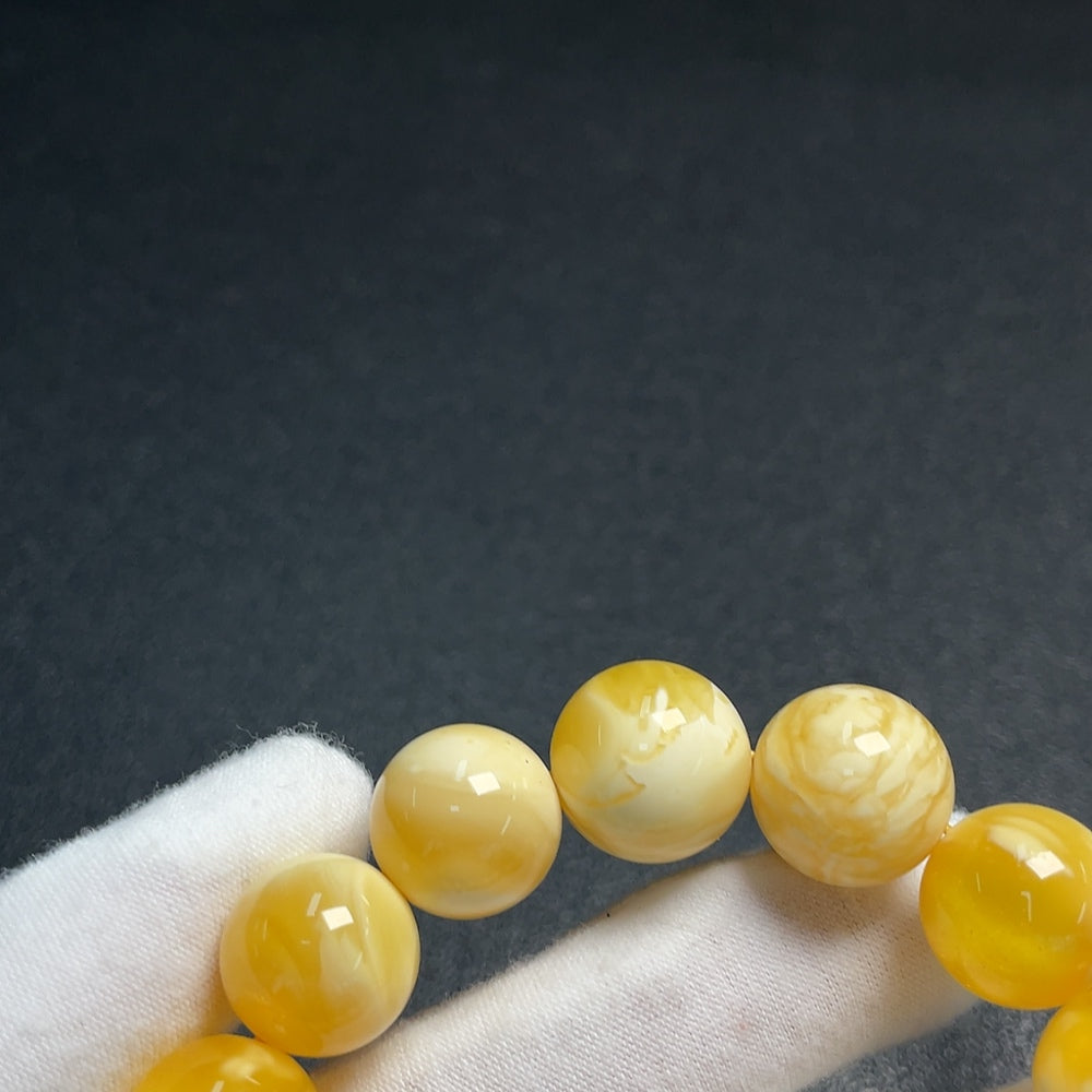 Huiliu Amber Beeswax Bracelet with 15.2mm amber beads, natural honey-colored, handcrafted jewelry, certified by HUILIU HQ.