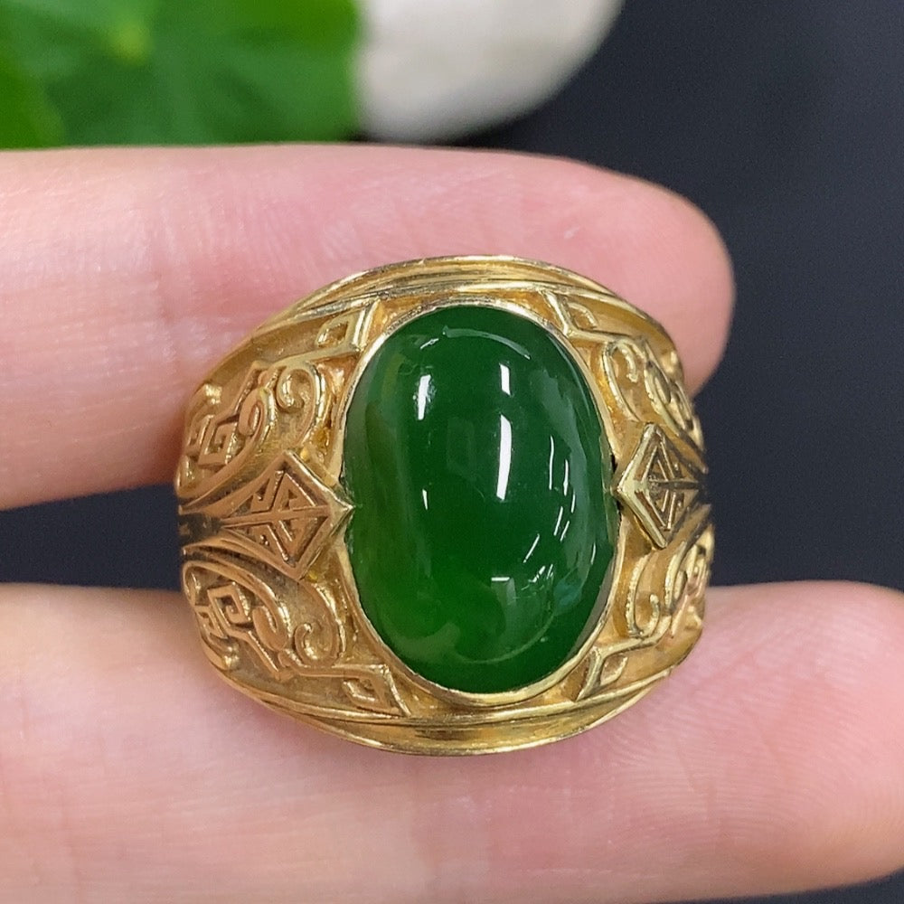 Elegant Jadeite cabochon ring with 18K gold band from HKHQ, showcasing a smooth, polished green gemstone setting.