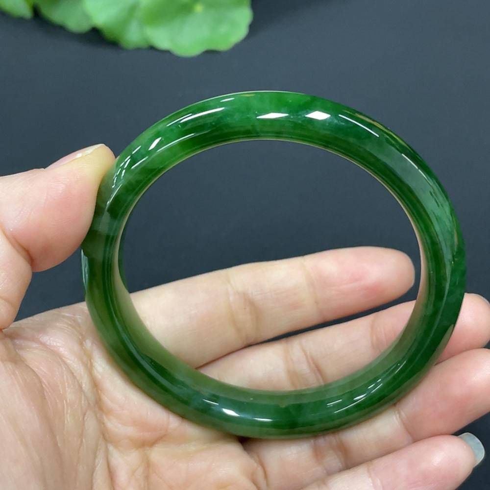 Huiliu certified Hetian jade round bracelet featuring smooth, polished jade beads on a delicate elastic cord.