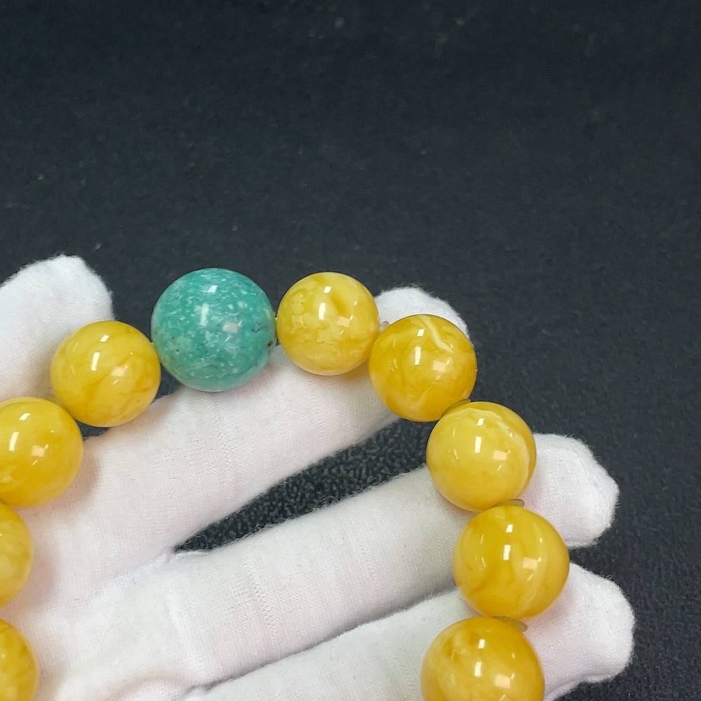 Amber beeswax bracelet with accent stones, 16.2mm size, from HUILIU HQ, showcasing the warm amber and decorative stones.
