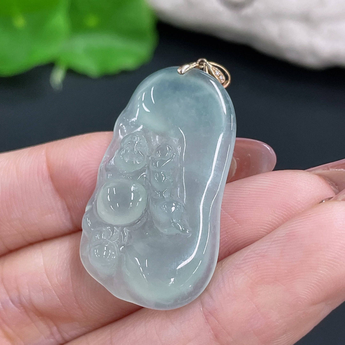 Huiliu Jadeite Buddha pendant with bezel, featuring a smooth, polished jade stone carved in a serene Buddha figure.
