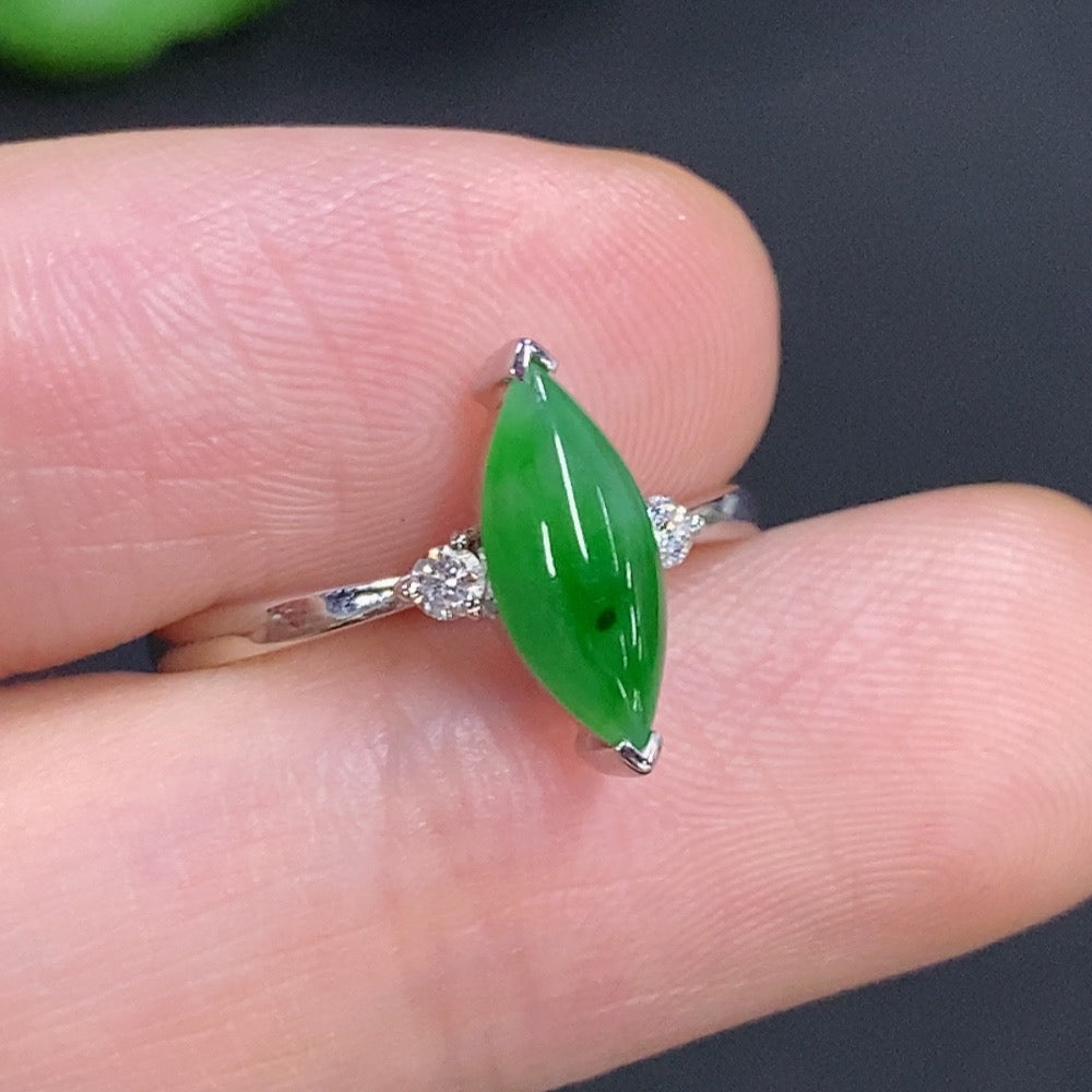Jadeite freeform ring with 18K gold band and diamond accents, showcasing a unique, organic design in a close-up image.