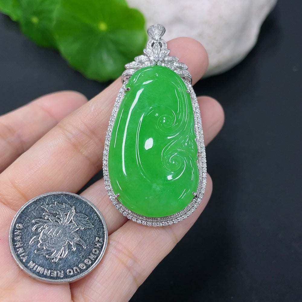Jadeite inlaid Ruyi pendant with 18K gold and diamonds, showcasing intricate craftsmanship and luxurious design.