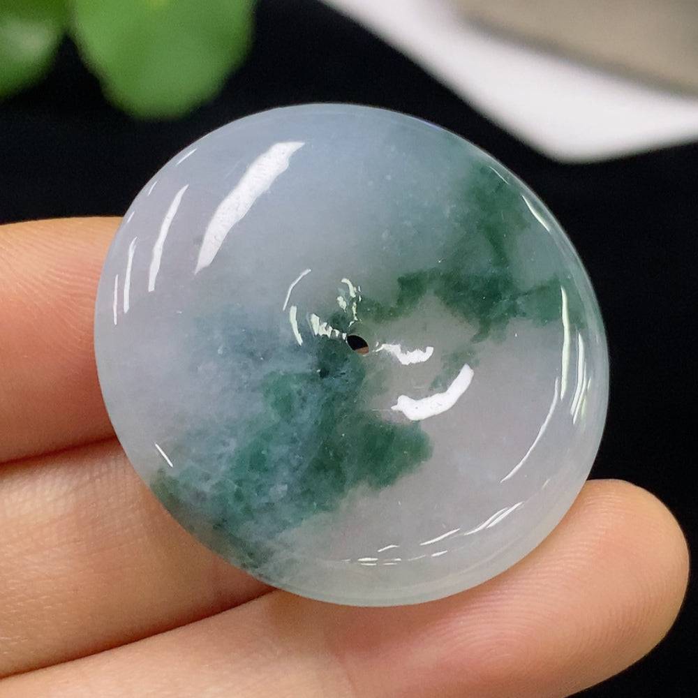 Huiliu Jadeite Peace Knot pendant, certified jade jewelry with intricate knot design, showcasing smooth, polished green jade.