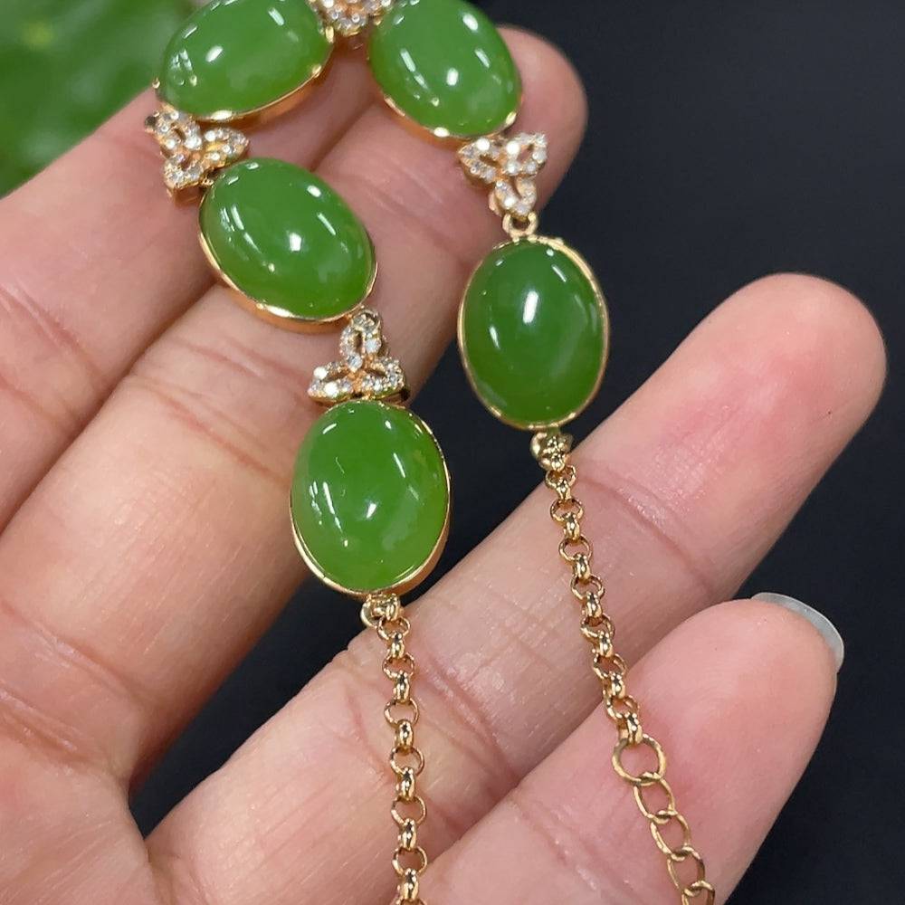 Huiliu Hetian Jade cabochon inlay bracelet with diamond accents and suspected plated parts, showcasing elegant craftsmanship.