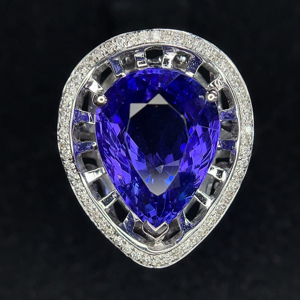 18K gold Tanzanite ring with diamond accents, size 11, showcasing a vibrant purple gemstone and sparkling diamond details.