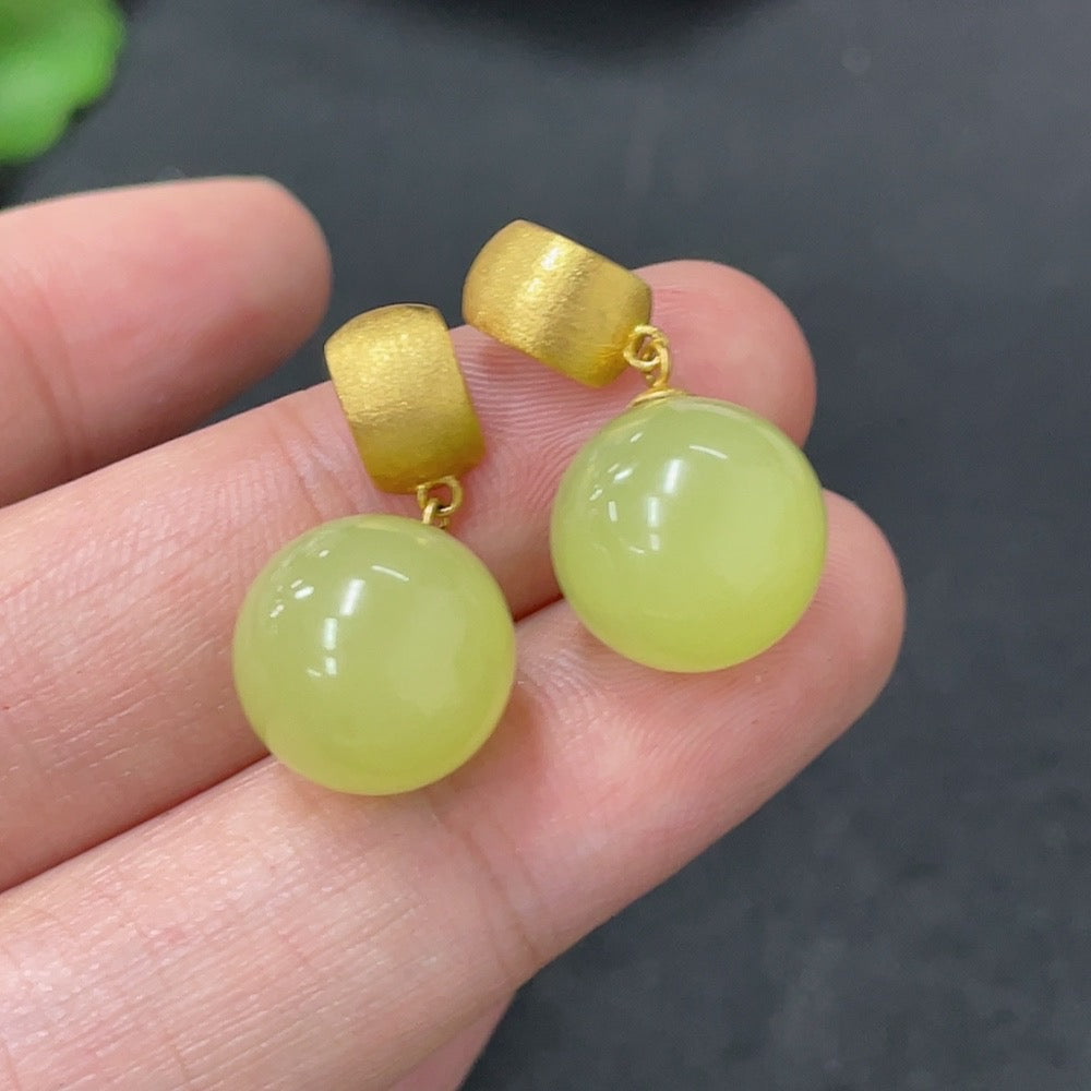 Hetian jade inlaid earrings with 18K gold setting, approximately 11.8mm in size, from HUILIU HQ.