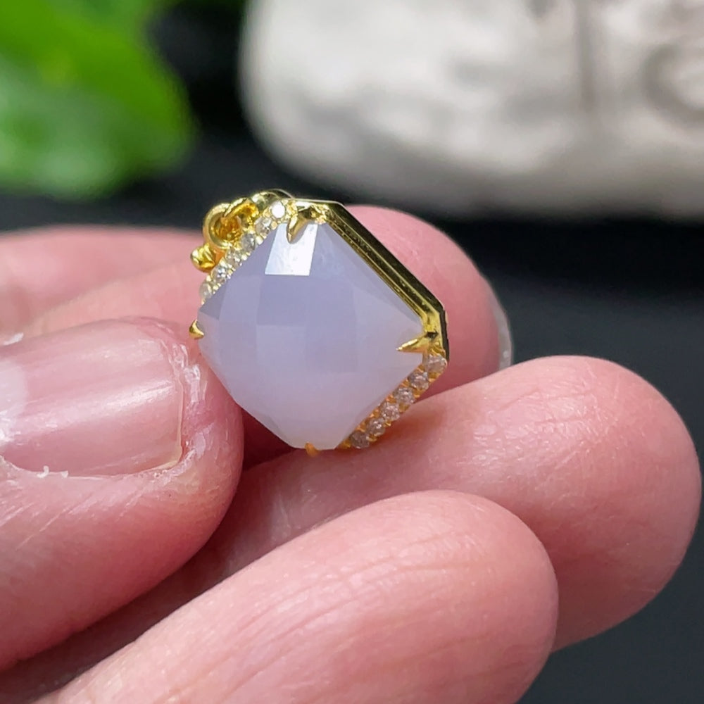 Huiliu Jadeite pendant with diamond accents on mount, featuring a polished green jade stone and elegant design.
