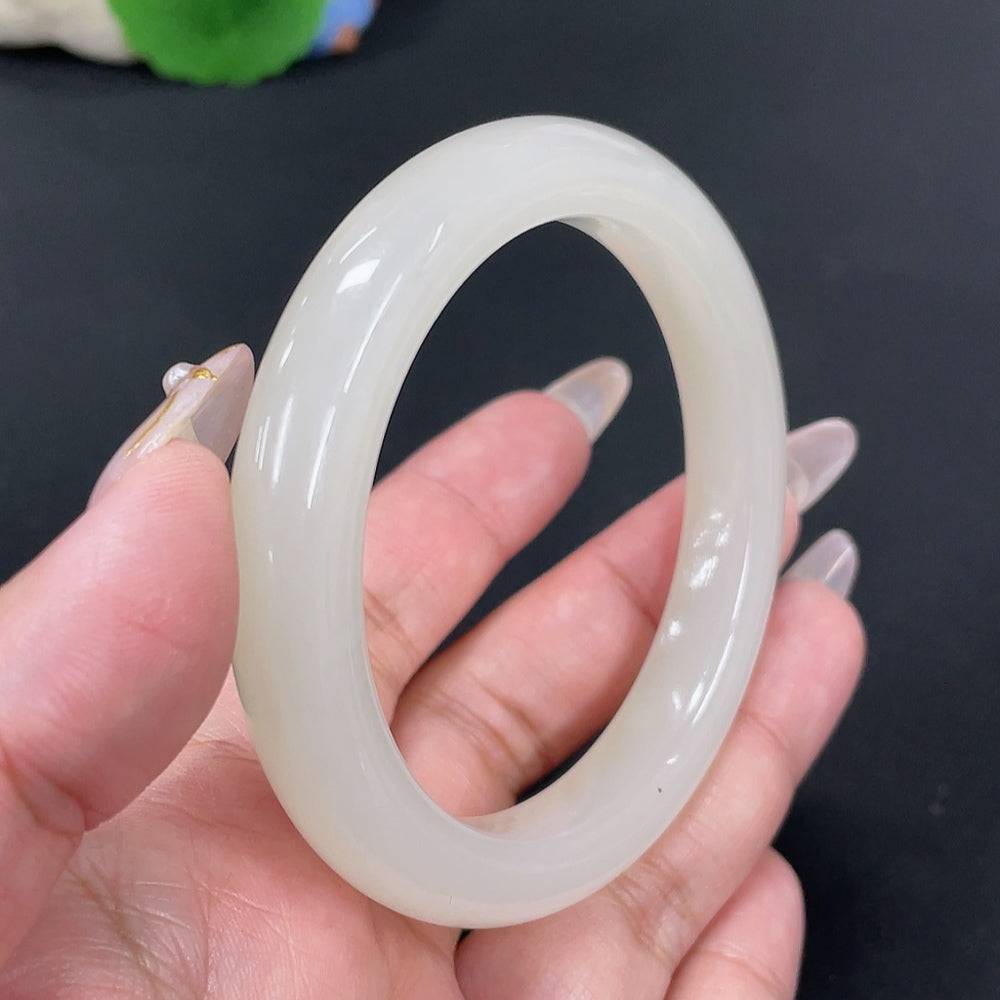 Huiliu certified Hetian jade round bracelet featuring smooth, polished jade beads on a delicate string.
