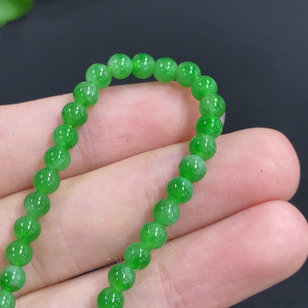 Jadeite single bezel pendant by HKHQ with 18k gold and diamond accents, featuring a 3.9mm jade stone on a chain.