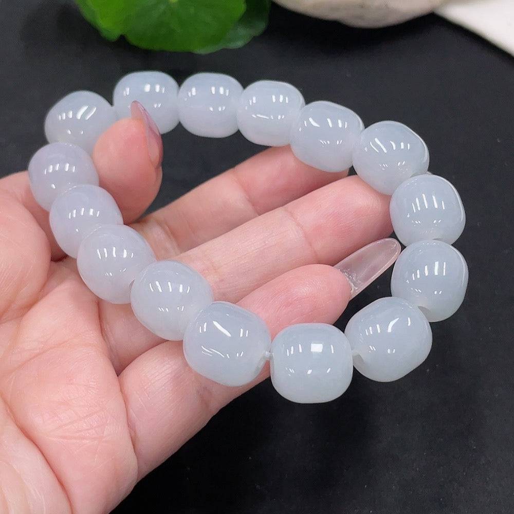 Huiliu Jadeite bracelet with 12.8mm beads, featuring smooth, polished green jade beads on a stretch cord.