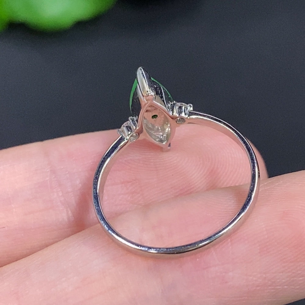 Jadeite freeform ring in 18K gold with diamond accents, showcasing elegant jewelry design and craftsmanship.
