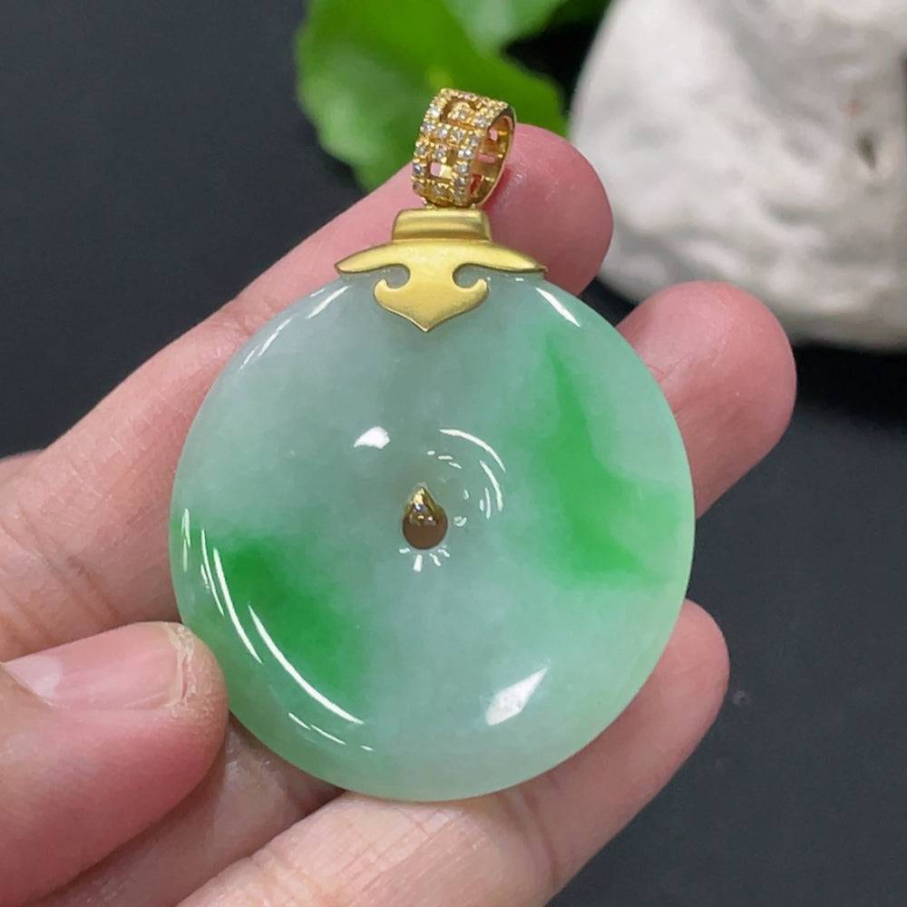 Jadeite peace knot pendant with 18K gold clasp and diamond accents, crafted by HUILIU HQ, weighing approximately 11.88 grams.