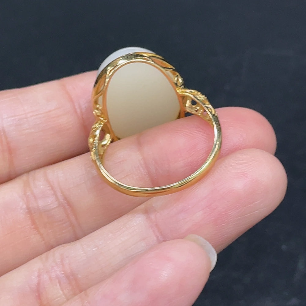 HKHQ Hetian Jade cabochon inlaid ring featuring smooth jade stone and intricate silver band design.