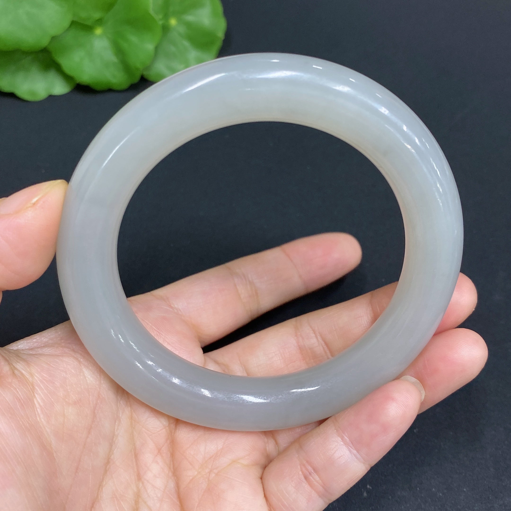 Huiliu certified Hetian jade round bangle, 58.3mm diameter, smooth polished surface, showcasing natural jade color and texture.
