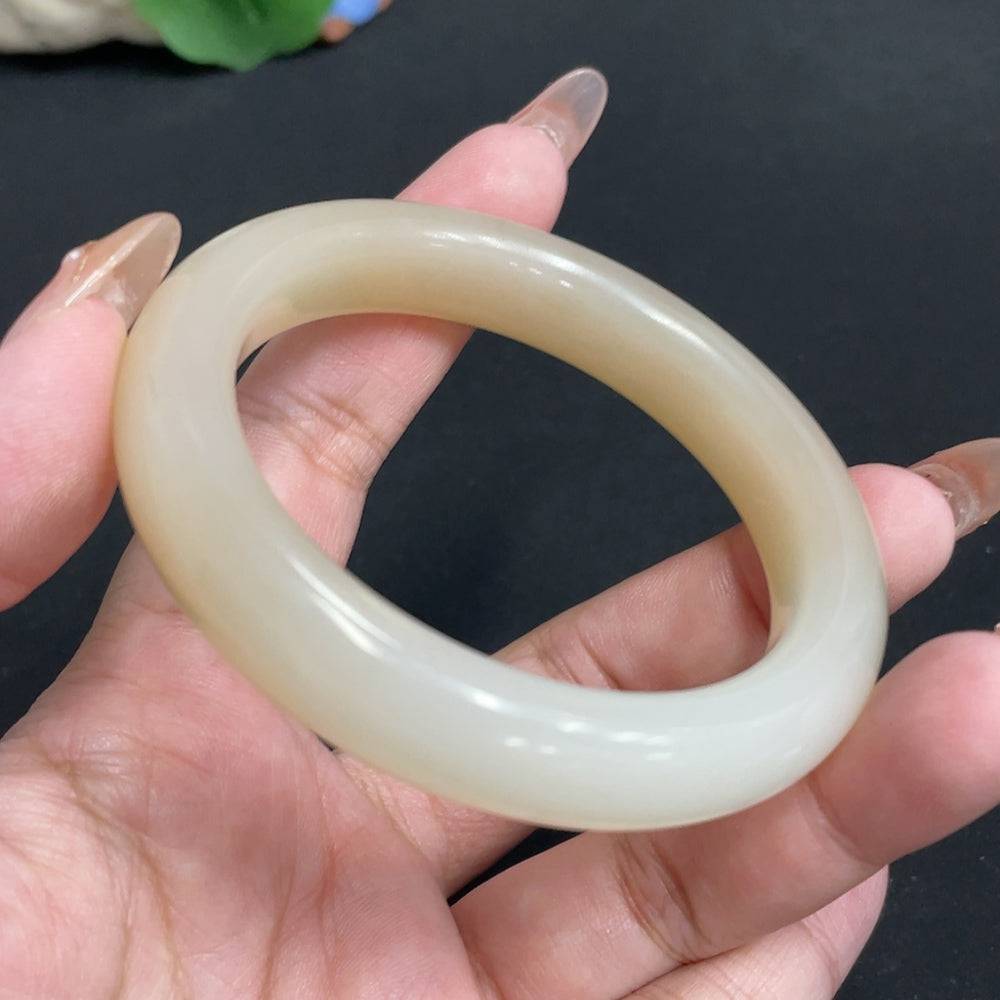 Huiliu Certified Hetian Jade round bracelet with digital collection certificate, showcasing smooth, polished jade beads.