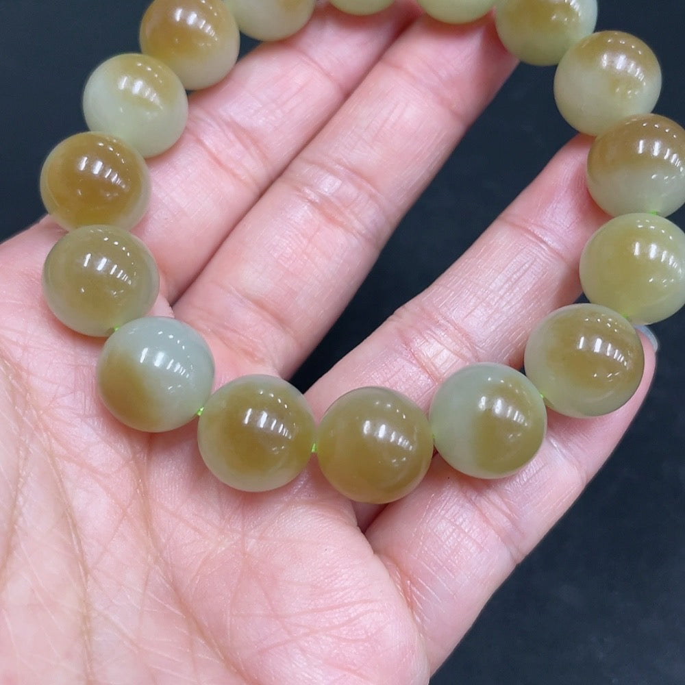 Hetian jade bracelet by HUILIU HQ featuring 11.9mm smooth jade beads, total weight 41.7g, elegant and polished jewelry piece.