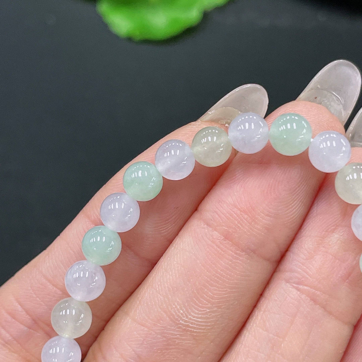 HUILIU HQ jadeite bracelet with 5.6mm beads, approximately 10.12g, showcasing smooth, polished green jade stones.