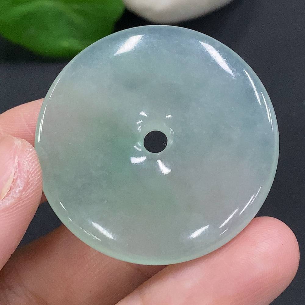 Jadeite Peace Knot pendant from HUILIU HQ, crafted from green jade, weighing approximately 17.4 grams, with intricate knot design.