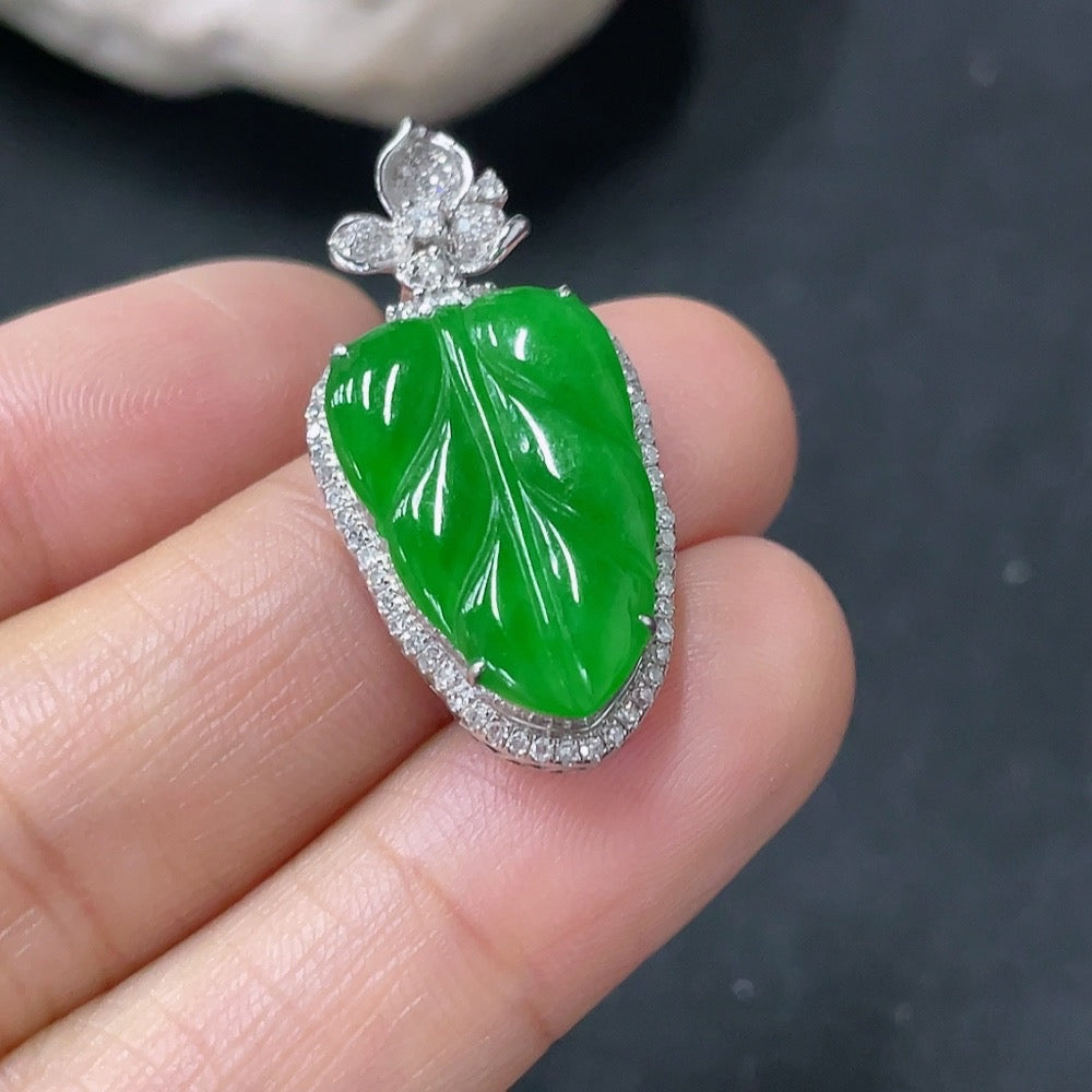 Huiliu Jadeite leaf pendant with diamond accents, featuring intricate leaf design and polished jade surface.