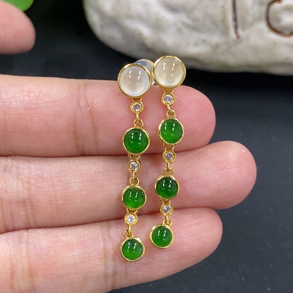 HKHQ jadeite cabochon earrings in 18K gold featuring smooth, polished jadeite stones with gold settings, elegant jewelry for special occasions.