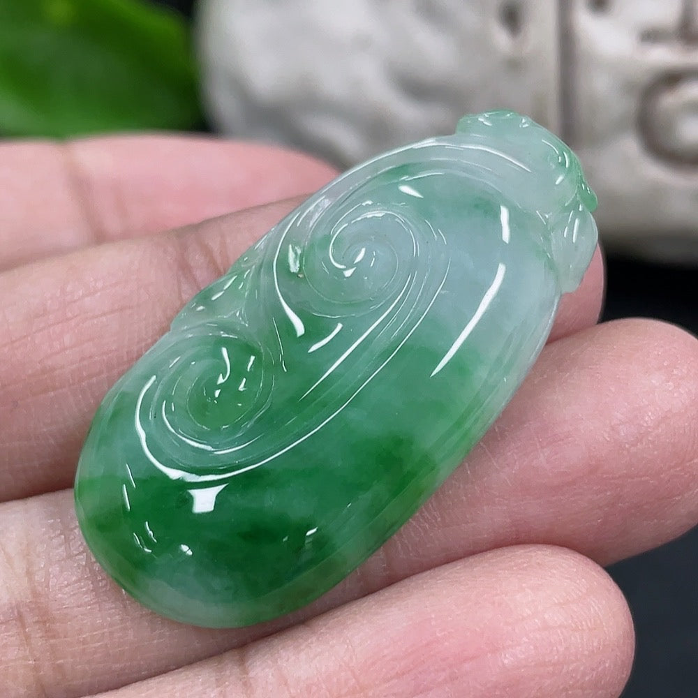 Jadeite Ruyi pendant necklace featuring a smooth, polished jadeite piece with intricate carving, from HKHQ.