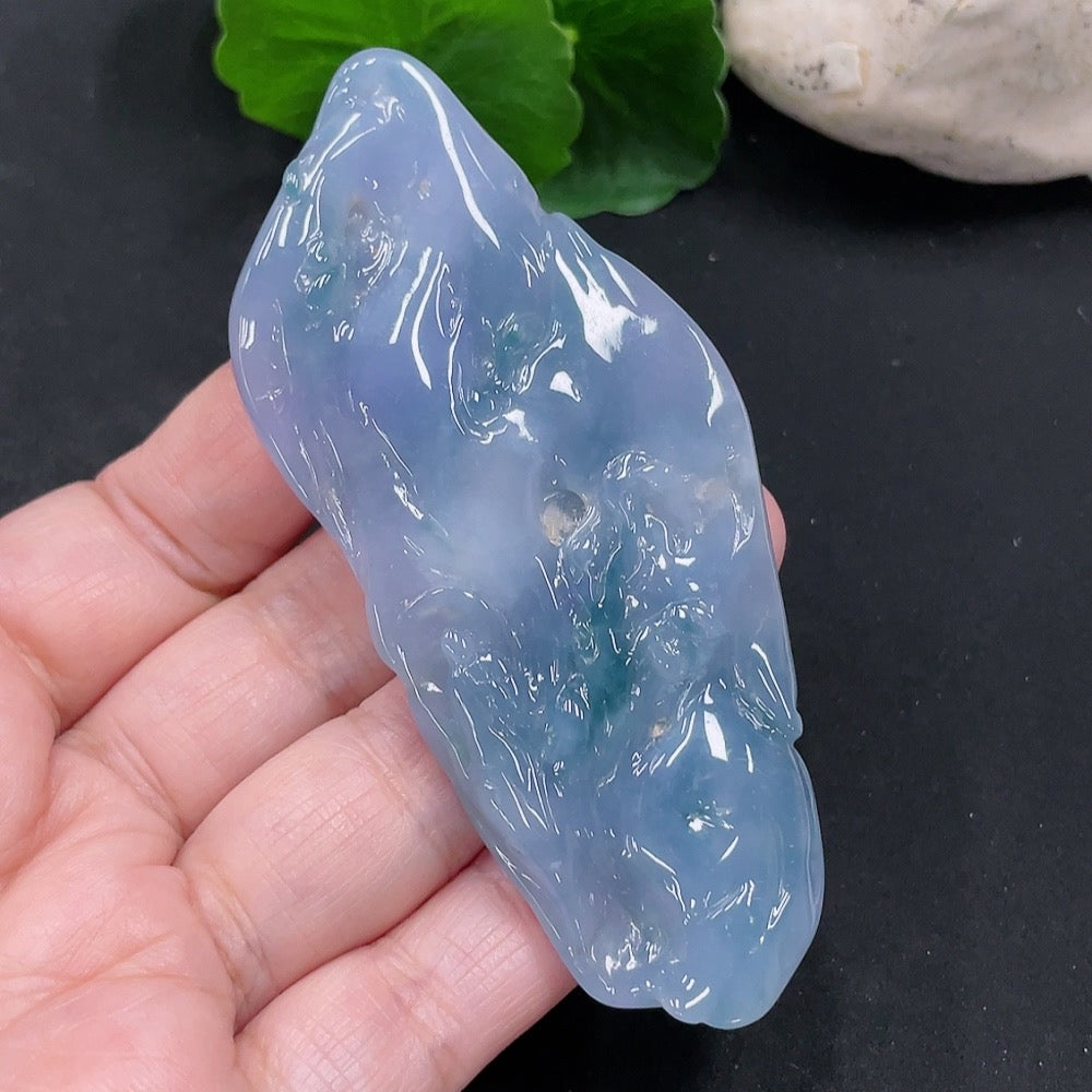 Huiliu Jadeite Enlightenment Pendant showcasing smooth green jade with carved design, certified by HUILIU HQ.