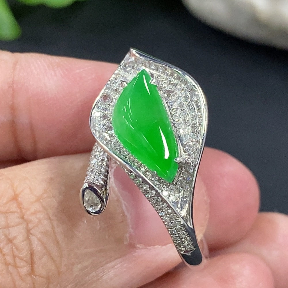 Jadeite freeform inlaid ring with 18K gold band and diamond accent, featuring an elegant, handcrafted design.