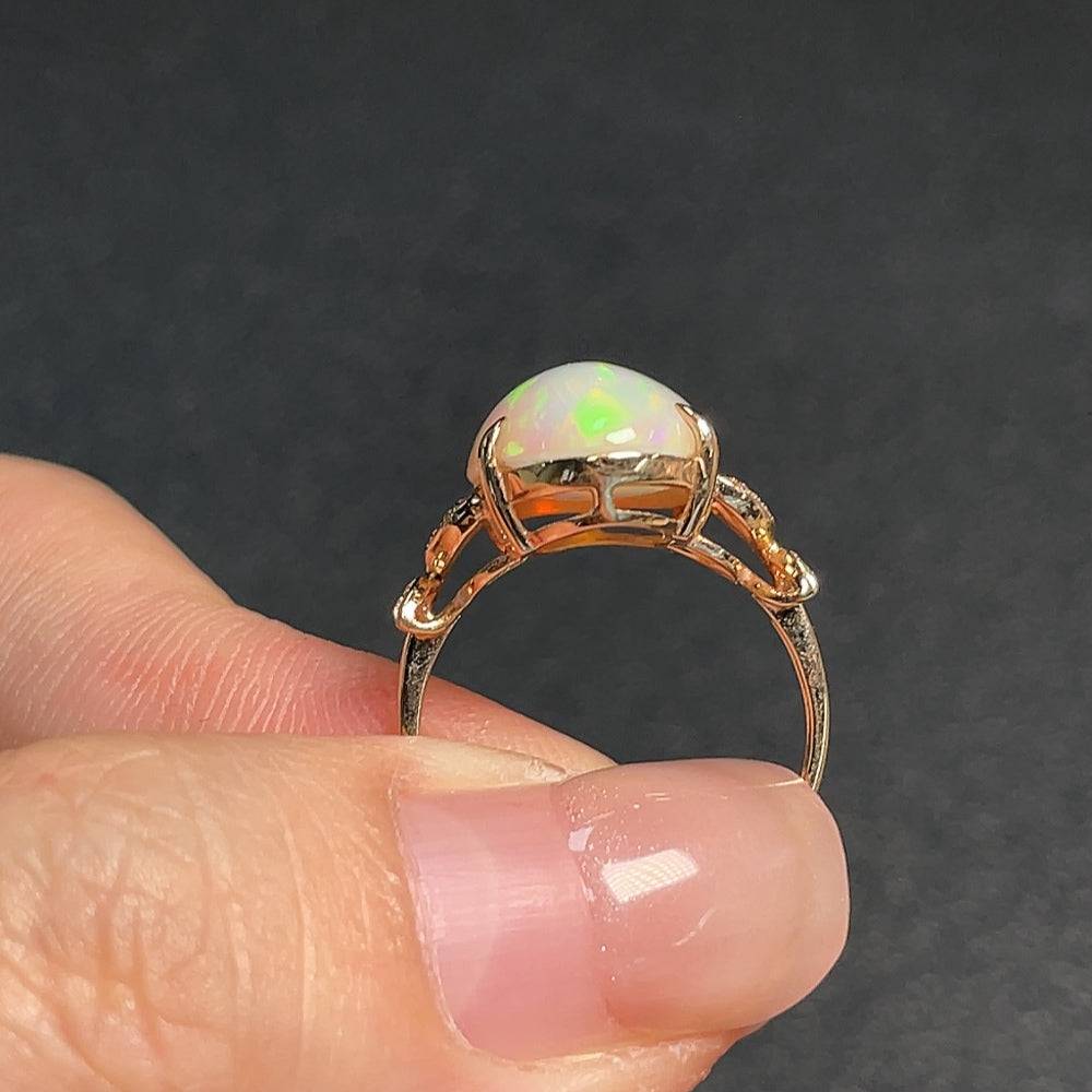 Huiliu certified opal gemstone ring with diamond accents, featuring 73% opal content and a 3-gram weight.