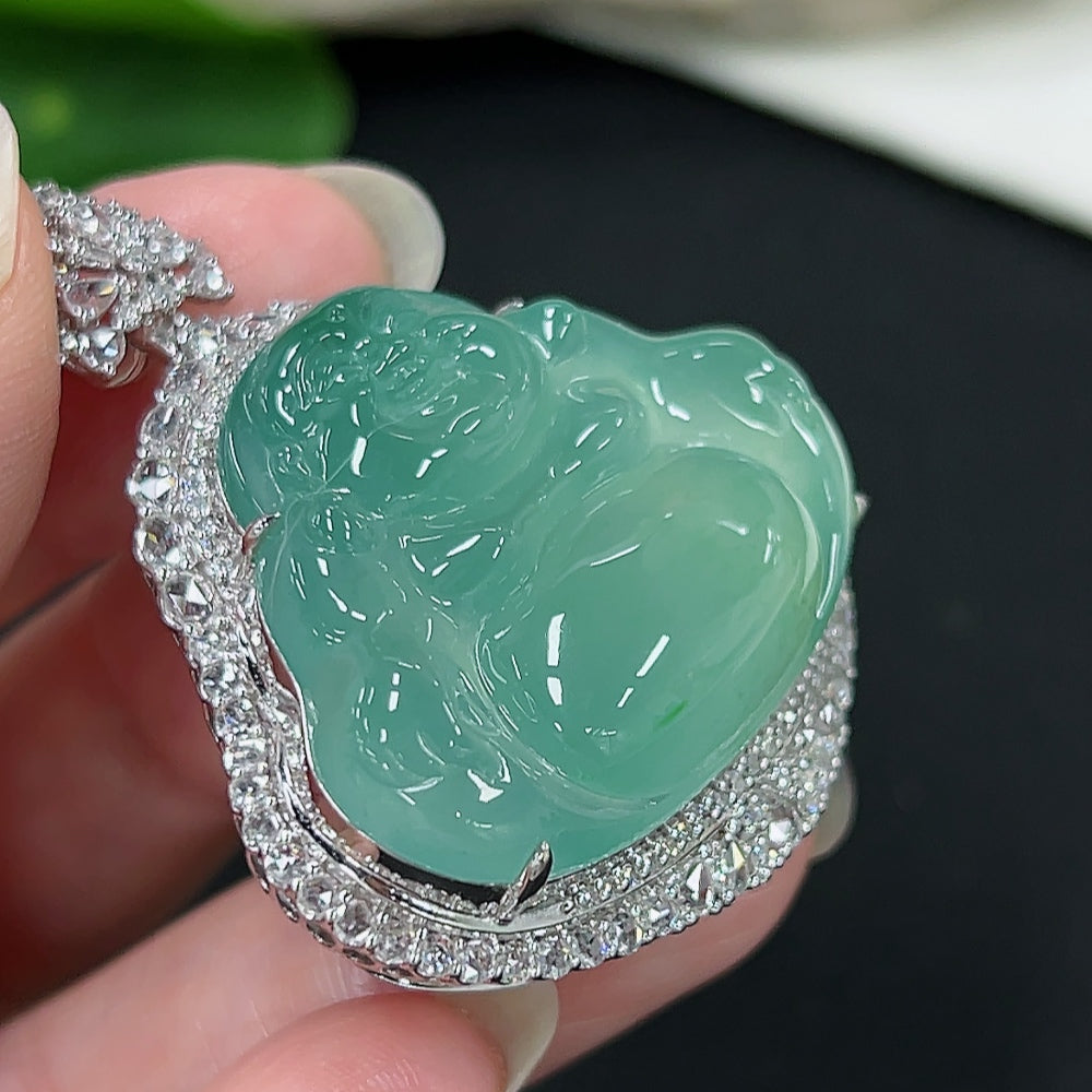 Jadeite Buddha pendant with diamond accents in 18K gold, weighing approximately 20g, displayed against a neutral background.