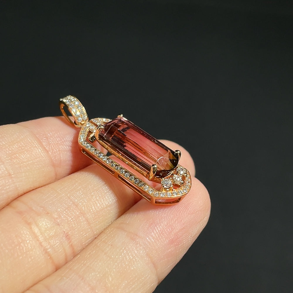 Tourmaline pendant with 18K gold and diamond accents, featuring vibrant gemstone and elegant jewelry design.