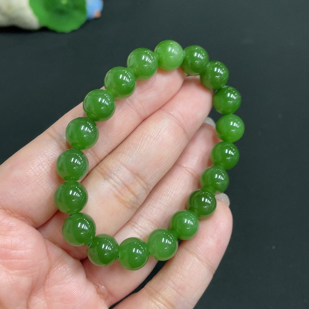 Hetian Jade Jasper bracelet with 9.3mm beads, crafted by HUILIU HQ, featuring smooth, polished jade stones on a stretchy cord.