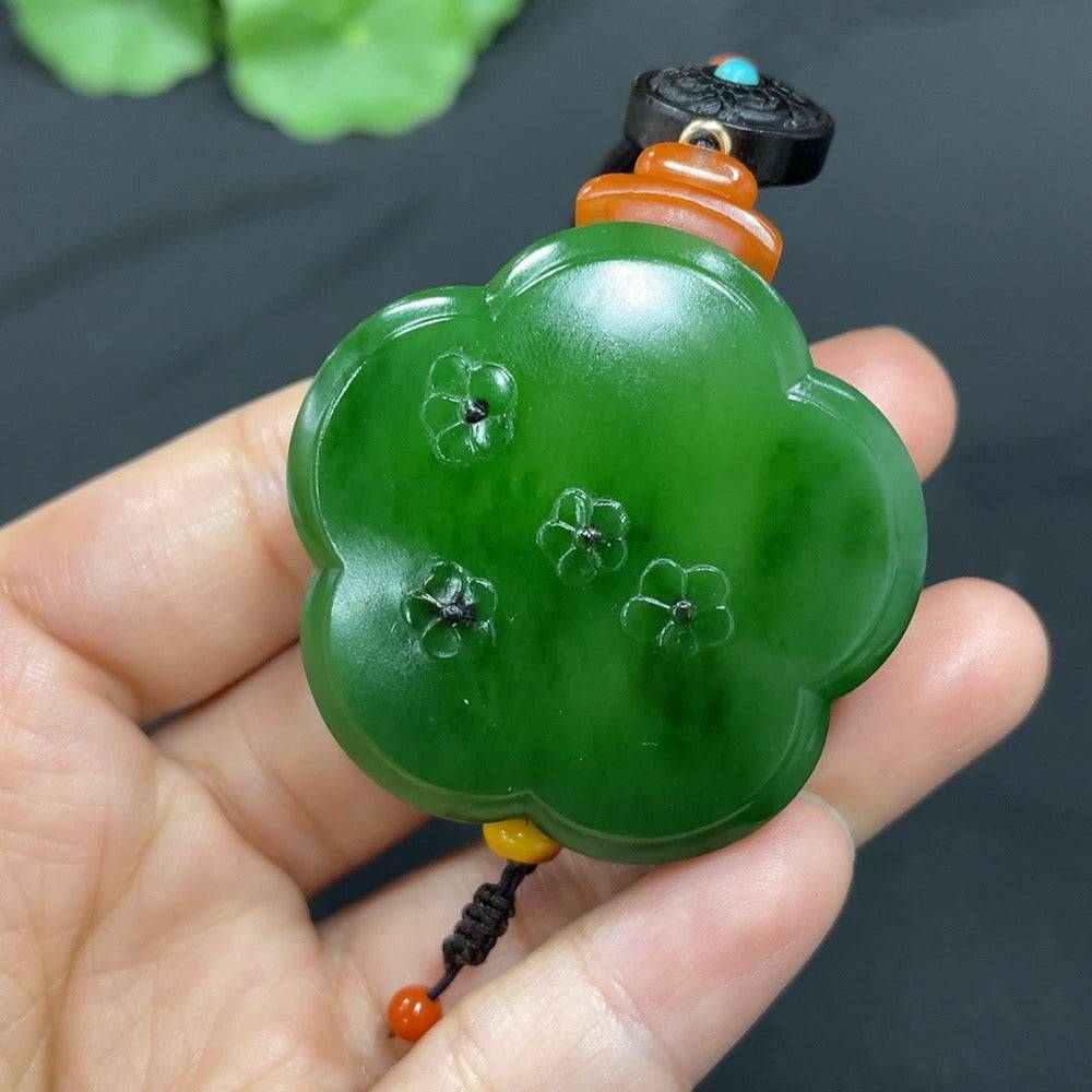 Hetian jade jasper pendant featuring blooming flowers and symbols of wealth, crafted by HUILIU HQ, with intricate natural stone details.