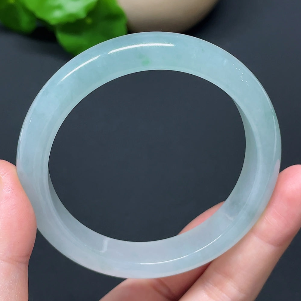 HKHQ jadeite round bangle in size 57.2 with a weight of 56.76g, showcasing smooth, polished green jadeite bracelet on white background.