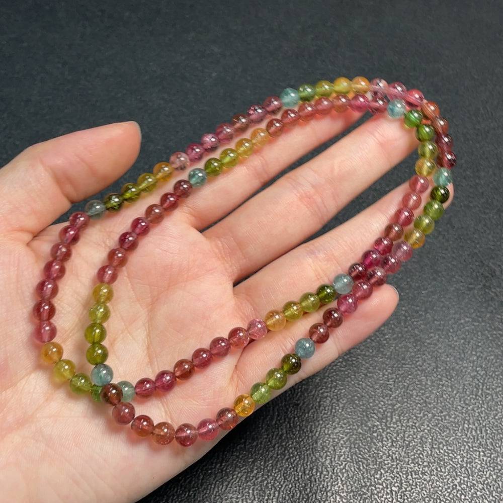Tourmaline gemstone bead necklace with organic matter and mineral components, 5.3mm beads, from HUILIU HQ.