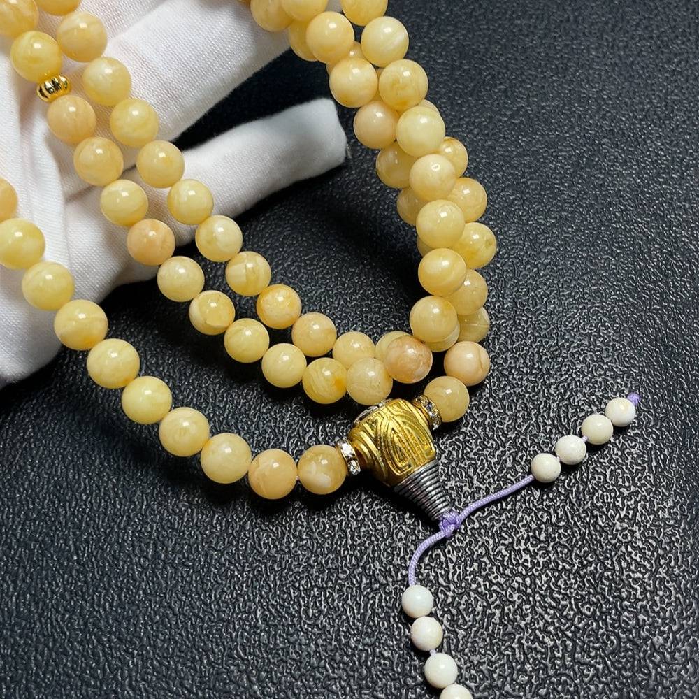 Amber Beeswax Bead Necklace by HUILIU HQ featuring 7.8mm amber beads on a delicate string.