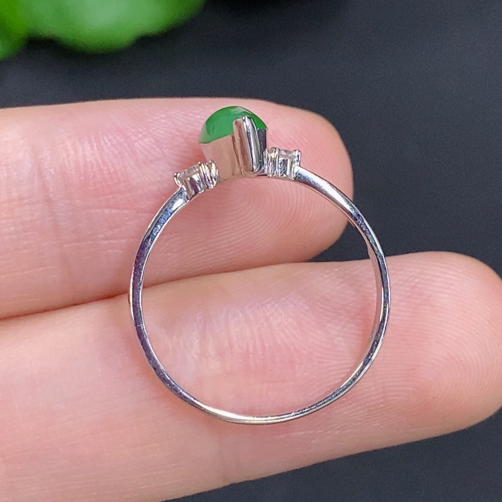 Jadeite freeform ring with 18K gold band and diamond accents, featuring organic, sculptural design and intricate detailing.