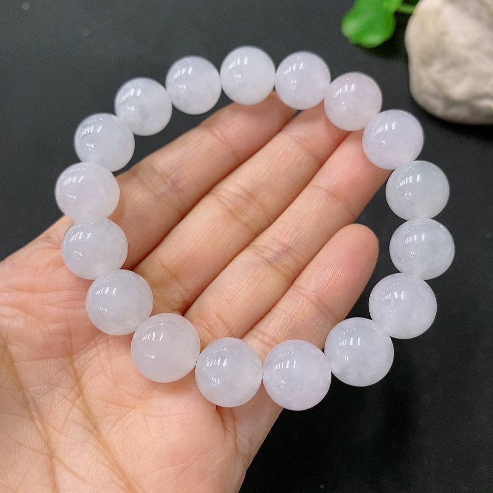 HUILIU HQ Jadeite bracelet with 12mm beads, showcasing smooth, polished green jade stones on a neutral background.