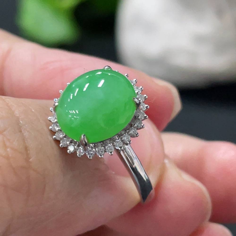 Huiliu Jadeite cabochon ring with diamond accents, featuring a polished green jade stone in a silver setting.