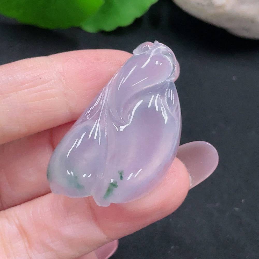 Huiliu Certified Jadeite pendant showcasing smooth, polished jade in a natural green hue on a neutral background.