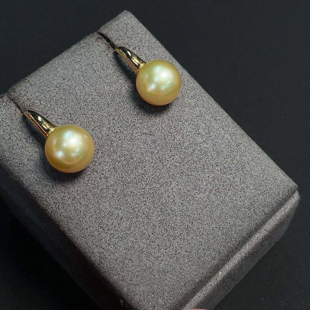 HUILIU HQ seawater pearl earrings set in 12mm pearls with a lustrous white color, featuring a classic and elegant design.
