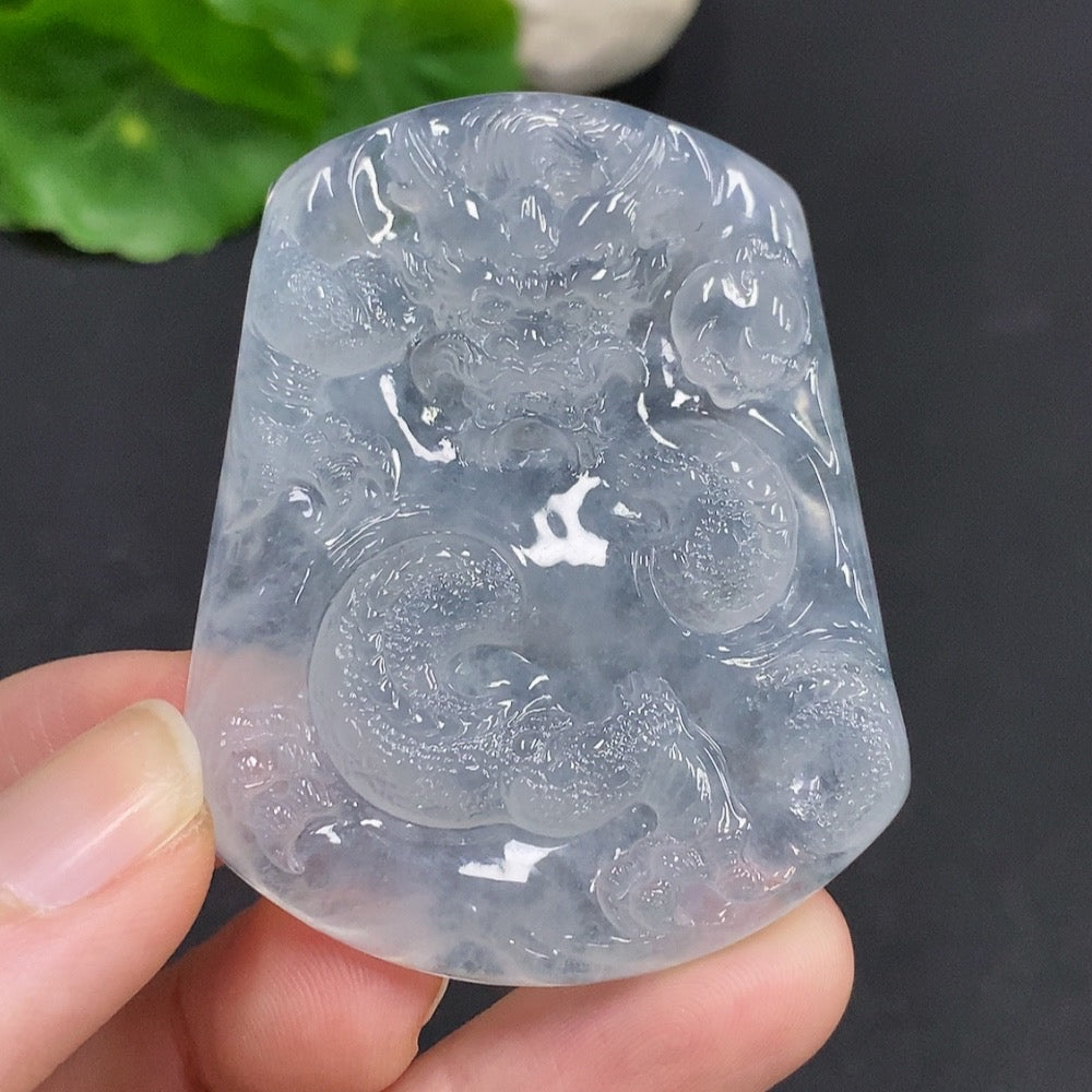Jadeite dragon pendant from HUILIU HQ featuring a soaring dragon design on smooth green jade gemstone.