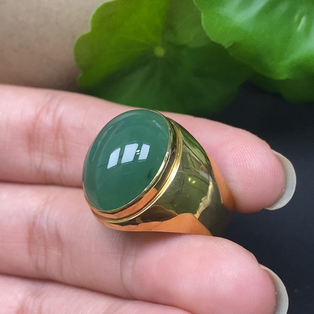 Elegant Jadeite ring featuring 18k gold setting from HKHQ, showcasing a polished jadeite gemstone on a detailed jewelry design.