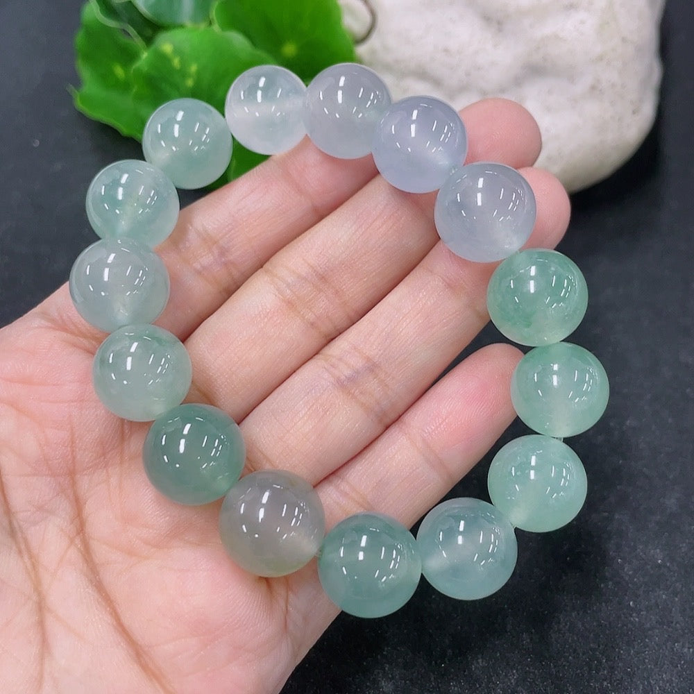 HKHQ jadeite bracelet with 13.4mm size and 56.13g weight, showcasing smooth, polished jadeite beads on a sleek bracelet.