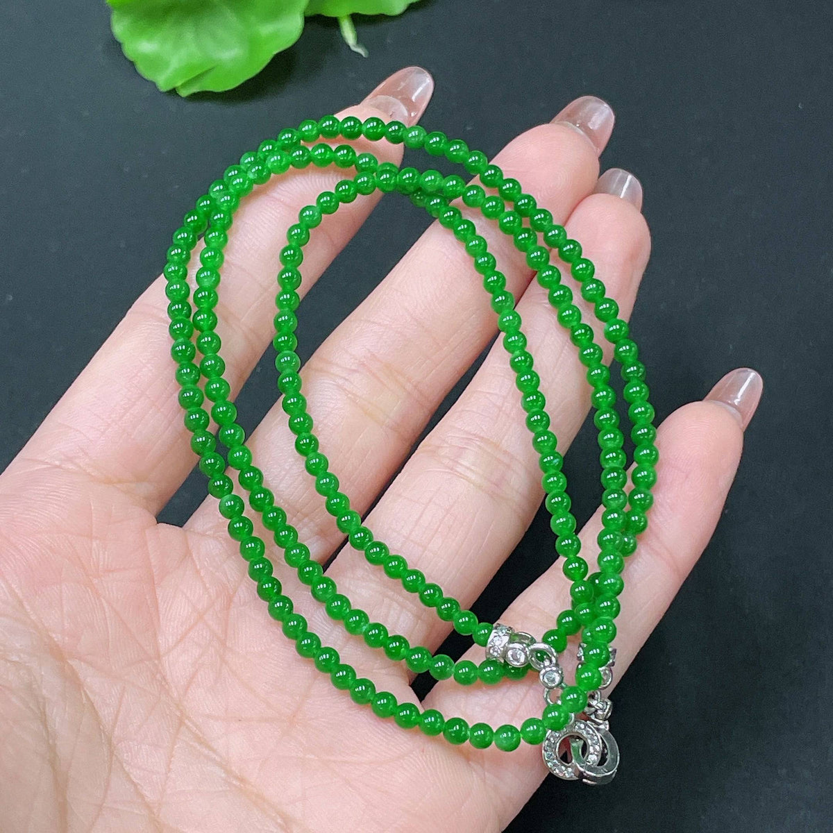 Jadeite bead necklace by HUILIU HQ with 3.1mm jade beads, non-gold, total weight approx. 11.4g, close-up of string of jade beads