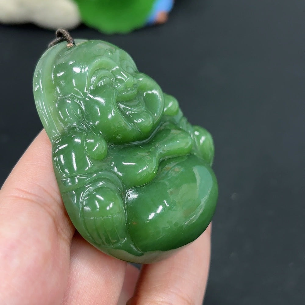 Hetian jade pendant featuring a Buddha design with a rope, weighing approximately 58.6g, crafted by HKHQ.