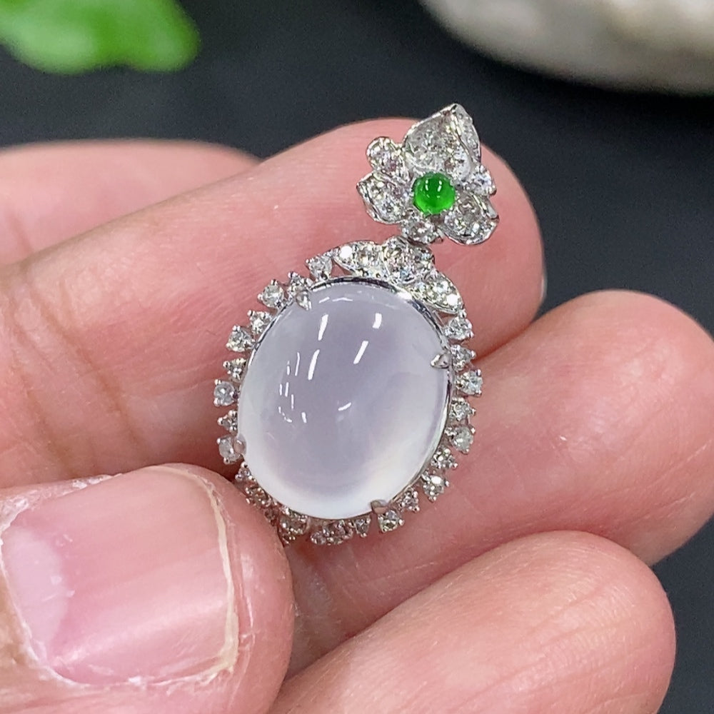 Jadeite cabochon pendant in 18K gold setting with diamond accents, weight approx. 1.81g, by HKHQ.