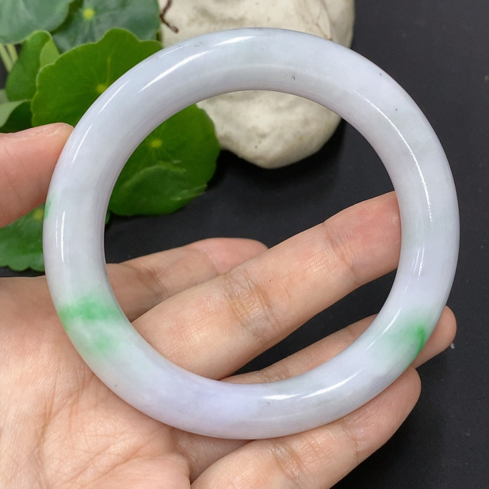 Jadeite round bangle with polished finish, size 56.8, weighing approximately 65.2g, featuring colorful polishing powder.