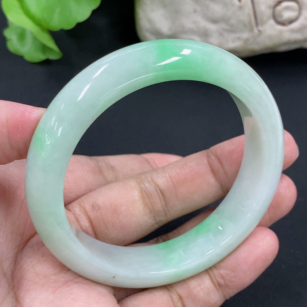 HKHQ jadeite round bangle with size 53.8mm, weighing 56.6g, showcasing a smooth, polished jadeite bracelet on a neutral background.