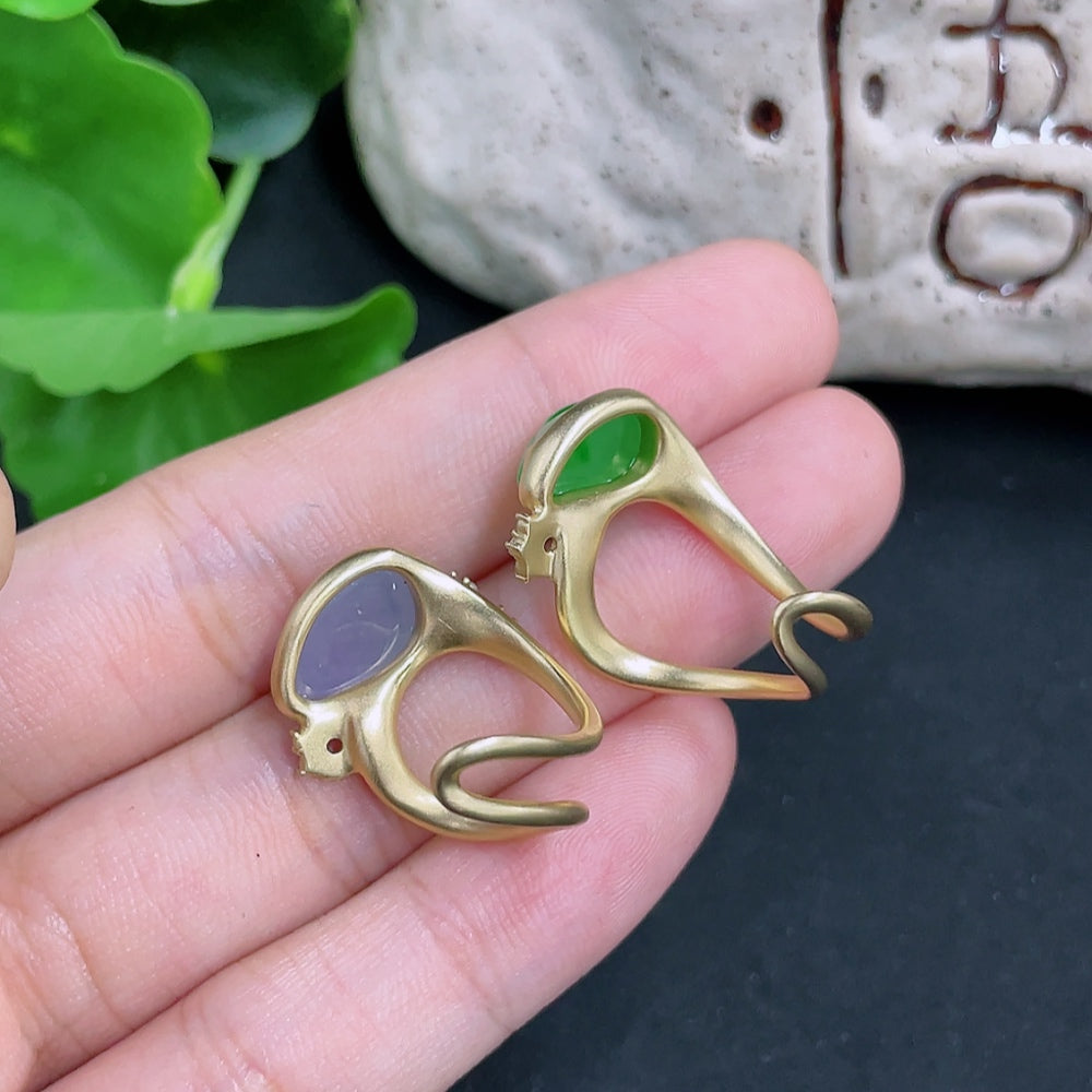 Jadeite inlaid ring with diamond accents in unmarked 18k gold, weighing approximately 6.7g, featuring intricate craftsmanship.